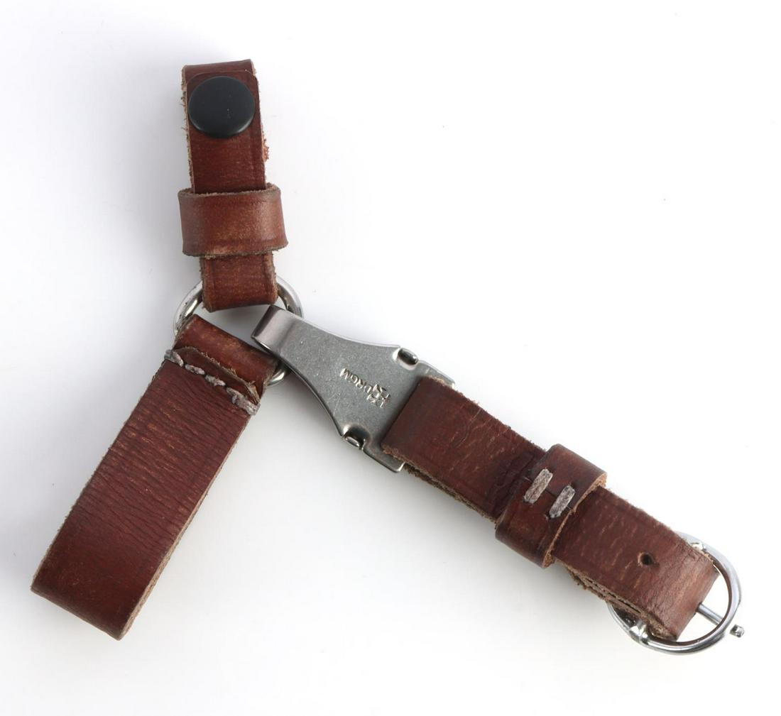 WWII GERMAN SS SA DAGGER THREE WAY HANGER: WWII German Waffen-SS marked SA 3-way dagger hangers. Brown leather with nickel fittings maker marked DRGM. Thread does fluoresce under blacklight. Overall very good condition. 6 1/2 inches. Unauthent