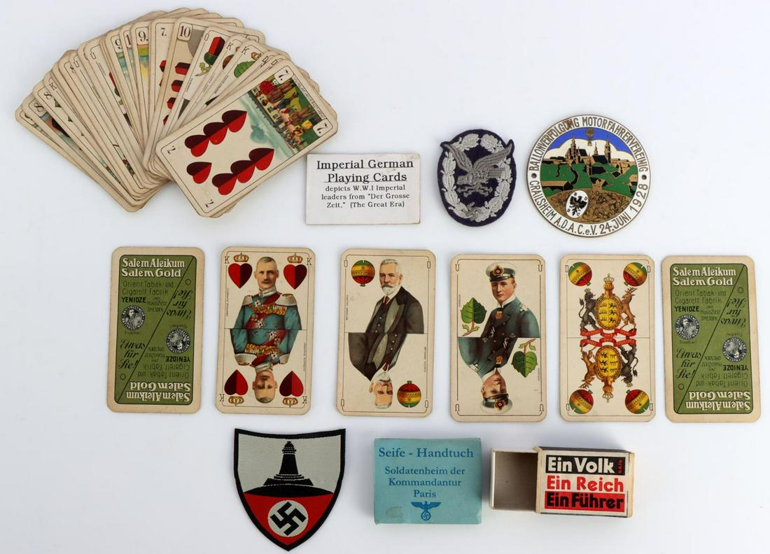WWII GERMAN REICH MEMORABILIA LOT OF 5: Lot features a Luftwaffe radio operator badge patch, matchbox, playing cards, motorist association badge, and a soap towel with propaganda. Very good condition. Measurements range 2 1/4 - 4 inches.