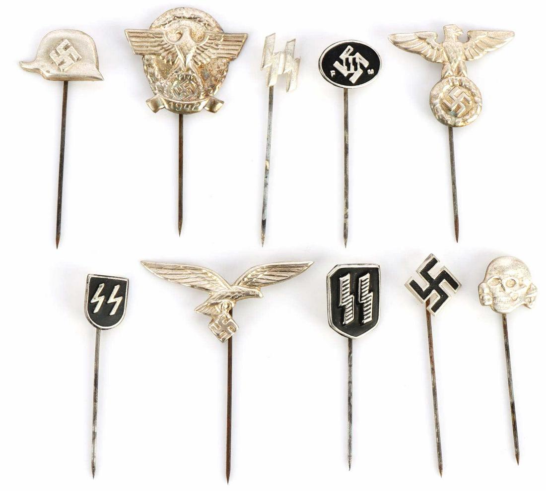 GROUP OF 10 ASSORTED WWII GERMAN STICKPINS: Lot of TEN (10) WWII German stickpins includes totenkopf, runes, helmets, and eagles. All in good overall condition. Items are unauthenticated, sold "as is". This lot has a reserve.