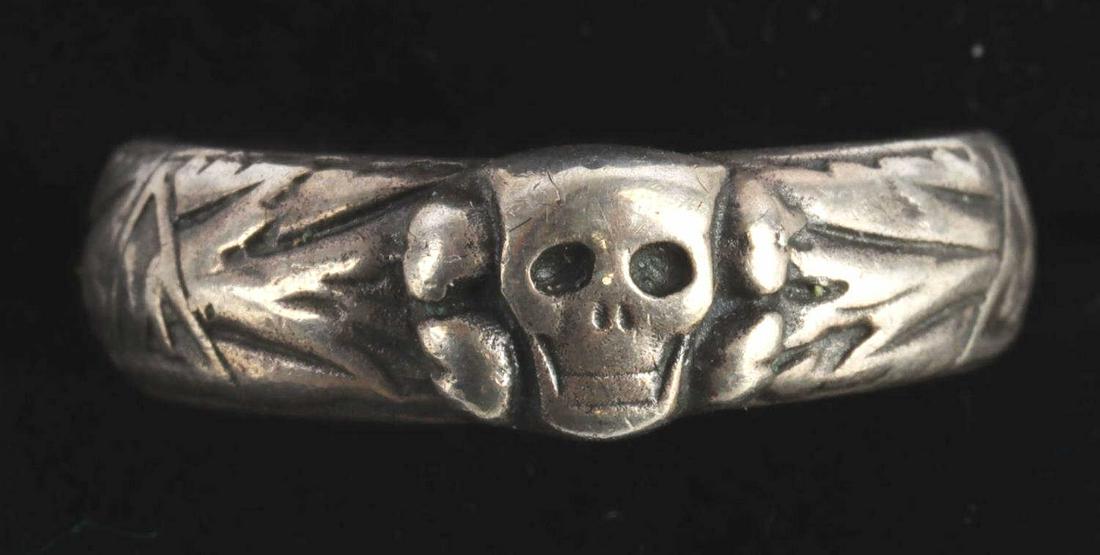 WWII GERMAN REICH WAFFEN SS TOTENKOPF SILVER RING: WWII German Reich silver SS Himmler Totenkopf honor ring with awarded name on interior and date "28. 03.36" alongside facsimile Himmler signature. Some detail worn on exterior bottom of ring. Good ove