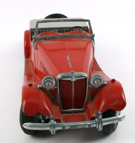 DOEPKE AUTOS MG MODEL CAR WITH ORIGFACTORY PAINT: Doepke Autos MG (MT) model car produced from 1954-1956. Model still features factory red paint job, and original dash decal. Hood comes off to show "Model Toys" Rosemoyne, Ohio U.S.A." Some minor pain