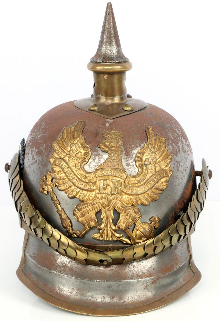 PRUSSIAN M1867 KURASSIER PICKELHAUBE HELMET: Lobstertail heavy cavalry style. Marked under left chinstrap rosette "1K 38". Left cockade not present. Finish loss intermittent on helmet body. No inner liner. Good overall condition. This lot has a