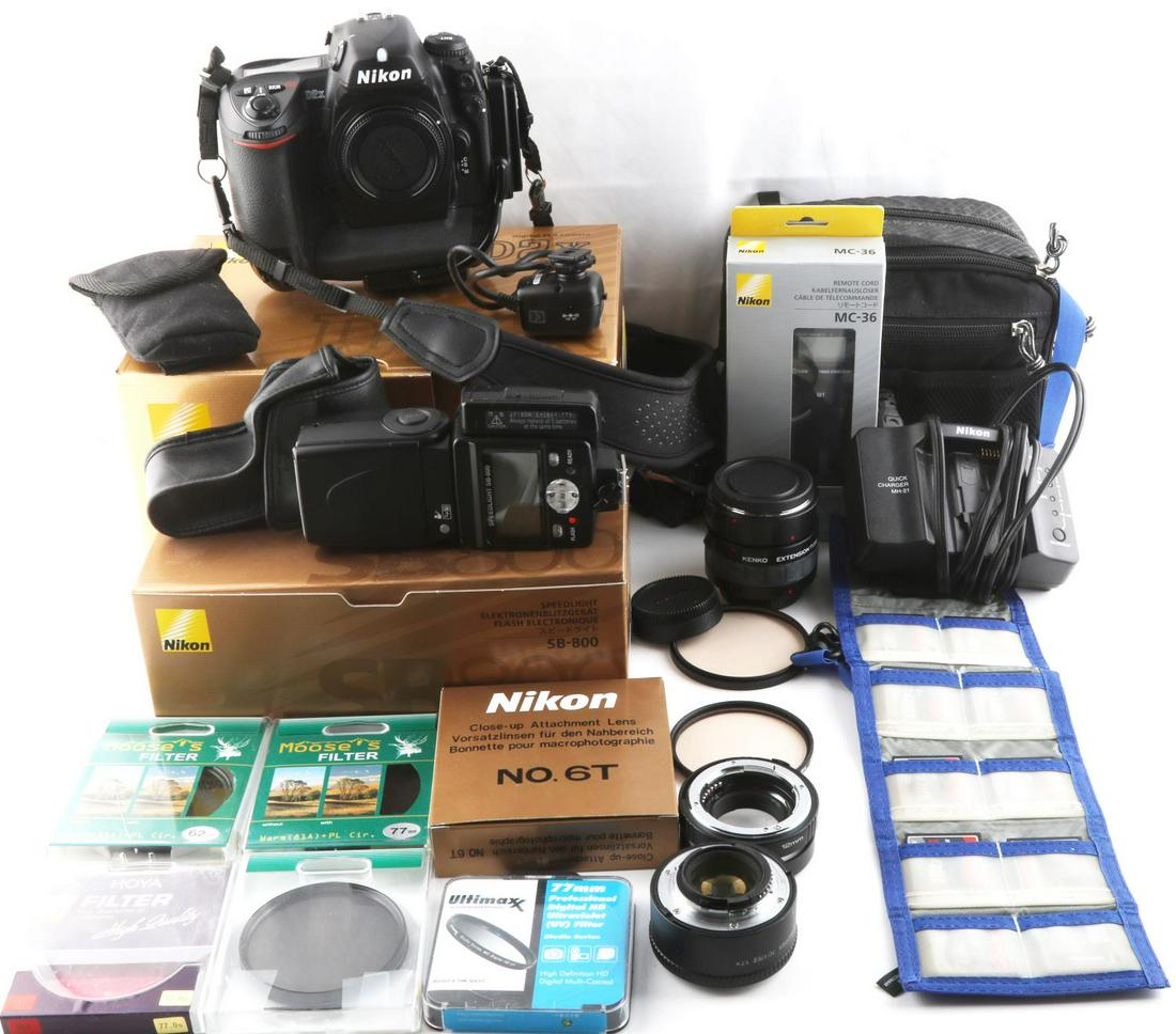 NIKON D2X DIGITAL SLR CAMERA WITH ACCESSORIES: Nikon D2X digital SLR camera with assorted filters and accessories. 12.4 megapixel sensor. Compatible with AF Nikkor lenses. Camera in very good condition with original box and paperwork. Well kept by