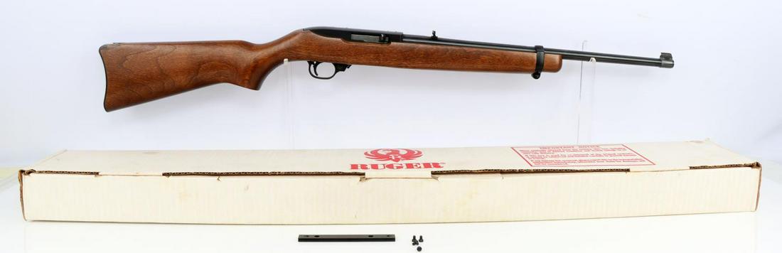 RUGER MODEL 10 22 SEMI AUTOMATIC RIFLE: 18 inch barrel, wood stock, like new condition. Minor scuffing on receiver. FFL required for transfer. No international shipping. Know your state laws prior to bidding. Caliber: 22 Serial #: 246-89796