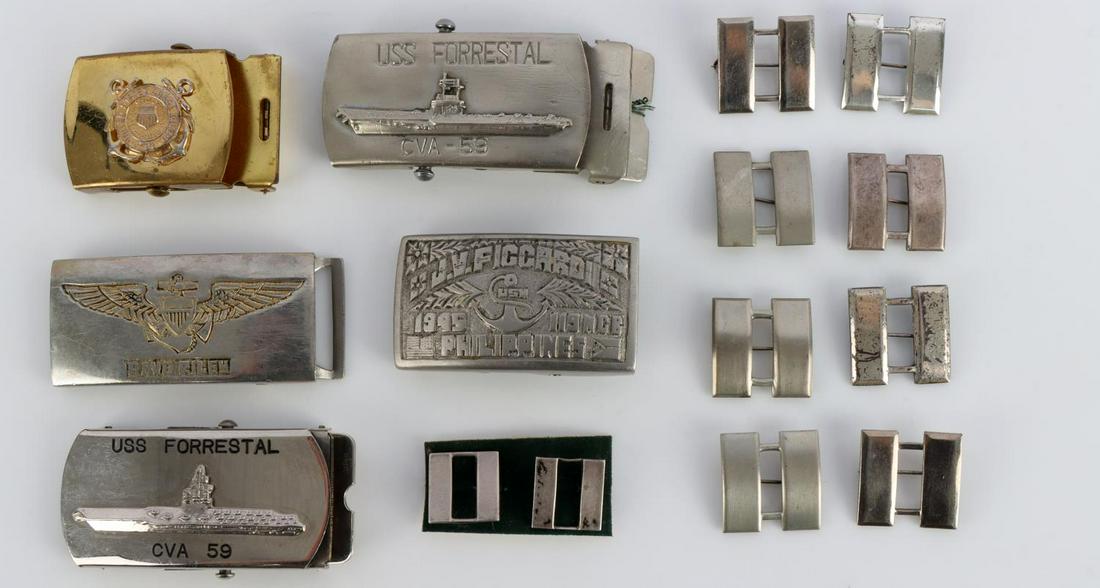 WWII TO VIETNAM BELT BUCKLE LOT 2 FORRESTAL SEABEE: Includes 2 USS Forrestal CVA 59 buckles. WWII named Philippines trench art NCB Seabee buckle, named USN Aviator buckle, and USCG buckle. All very good and original. Also Lt. Or Capt. insignia, smalles