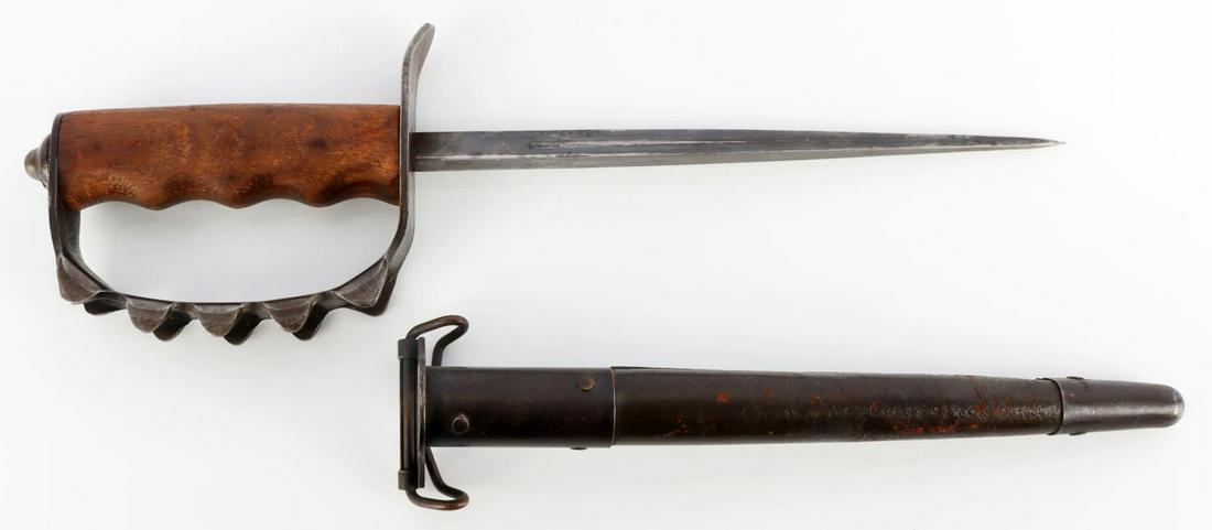WWI A.C. CO USA 1917 TRENCH KNUCKLE DUSTER KNIFE: WWI A.C. Co. USA 1917 Knuckle Duster trench knife with sheath. Very good condition with weathering to leather on sheath. Sheath is marked "Jewell-1918". Knife is marked on handle "AC. Co. USA 1917". O