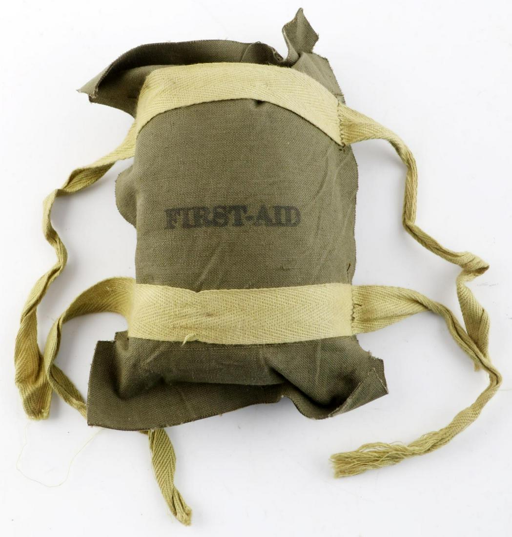 WWII AIRBORNE TIE ON SEALED FIRST AID KIT: On side has Kos Co 1942, believed second pattern, has been worn but sealed, Tear corners on top and bottom.