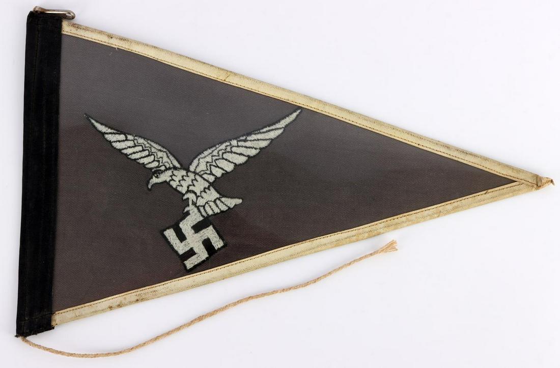 WWII GERMAN THIRD REICH LUFTWAFFE CAR PENNANT FLAG: Double sided embroidered eagle on grey flag. Measures 12 1/2 inches. Non-fluorescing. Very good condition. Protective plastic is covering the grey area of the flag.