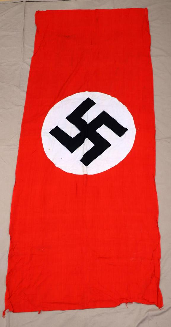 WWII GERMAN THIRD REICH NSDAP 75X29 PARTY FLAG: WWII German NSDAP party flag. Red rectangular flag with a white roundel to center with a black swastika. Flag does not fluoresce except for some stains on the roundel. Overall very good condition with