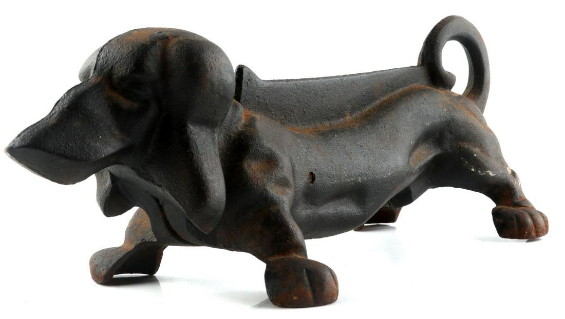 ANTIQUE CAST IRON DASCHUND SCRAPER DOOR STOP: Cast Iron dog boot scraper figural circa 1930'3- 1940's is in unaltered original condition with light rust but no pitting, well fitted seams and combination screw.