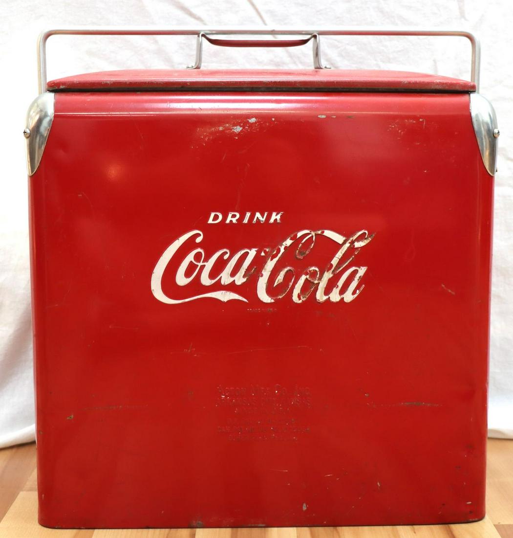 ANTIQUE COCA COLA COOLER ACTION MFG. COMPANY: 1950'S Very good original condition, weighs 17.6 pounds, measures 17 by 16 3/4, with side drain and embedded opener on same side, has internal tray, some wear but overall very good and original.