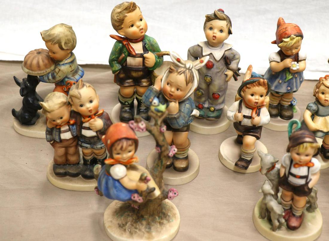 LARGE LOT OF 27 HUMMELS PORCELAIN FIGURINES: None in boxes. As photographed.