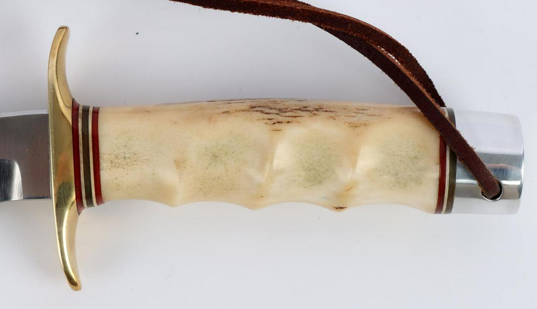 RANDALL KNIFE MODEL 4 7" BIG GAME & SKINNER: Avoid the 5-6 year wait list to get your U.S. made Randall knife. 7 inch blade with 4 5/8 inch stag grip. Brass crossguard. Nickel pommel. Comes with leather sheath and sharpening stone. Name on rever