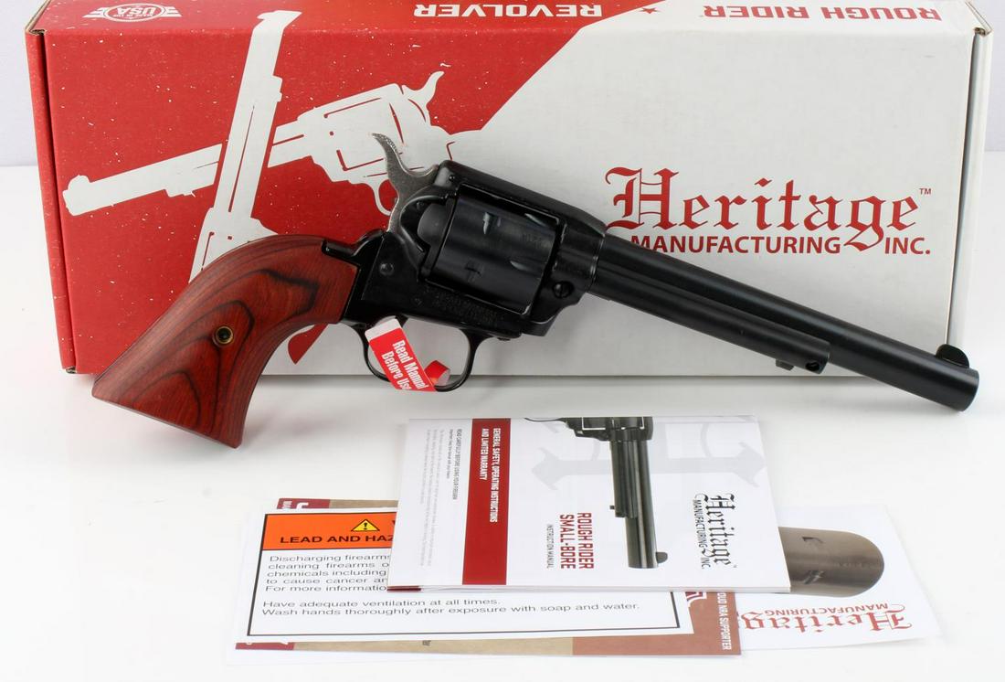 HERITAGE ROUGH RIDER .22 CAL 6 SHOT REVOLVER NIB: Blued steel, red wood grips, 6.75 inch barrel, mint bore, & clear markings. Comes new in box with manual and lock and key. Requires FFL for transfer. No international shipping. Know your state laws pr