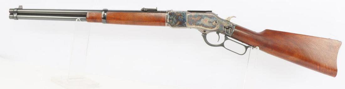 NAVY ARMS CO MOD 73 LEVER ACTION RIFLE 44-40 CAL: Navy Arms Model 73 Carbine in .44-40 caliber with a ten round capacity and a 19 inch barrel. Made in Italy. Smooth metal butt plate. Blued hand lever, receiver, un-textured trigger, serrated hammer, m