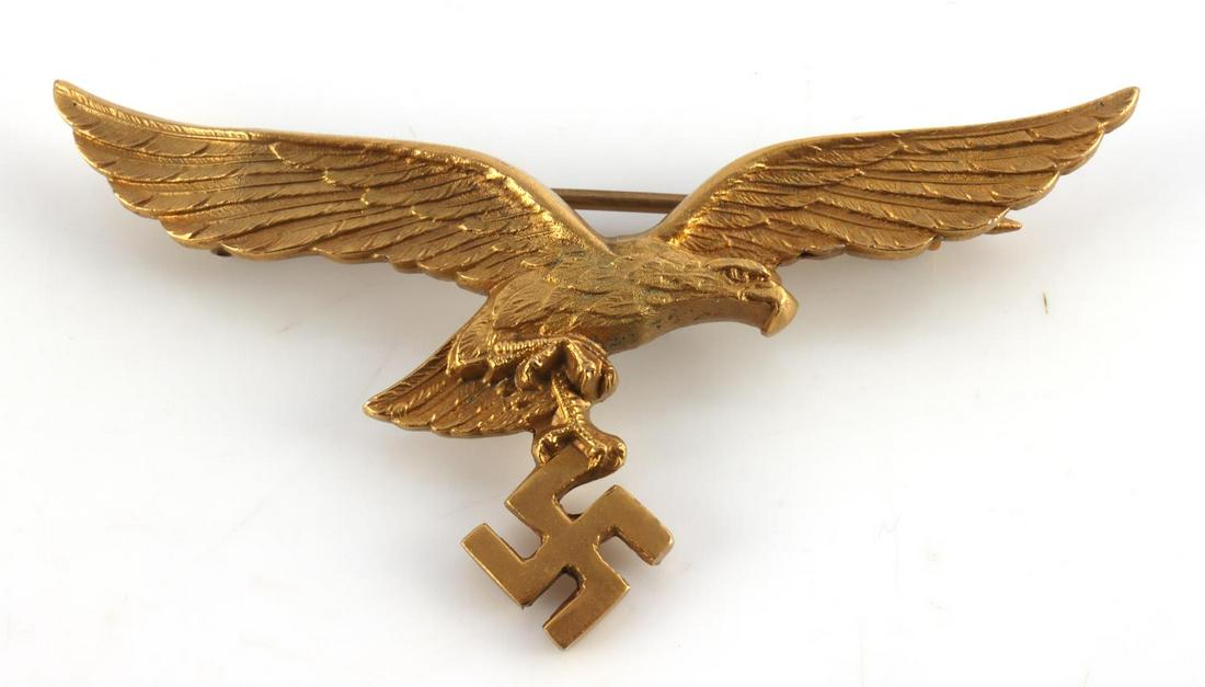 WWII GERMAN THIRD REICH LUFTWAFFE BREAST EAGLE: Pilot officer gold breast eagle, Swastika is molded but not flush with eagle, no makers mark. Unauthenticated sold as is.