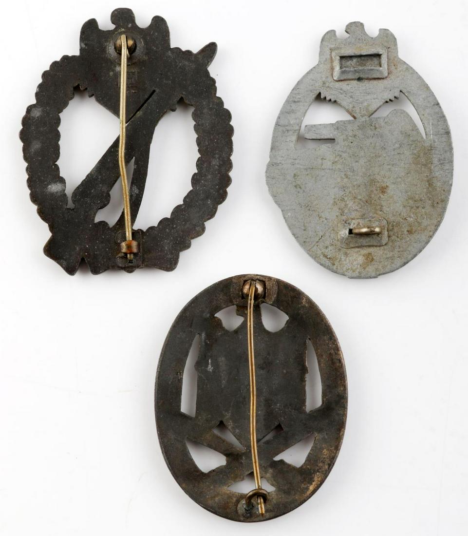 3 WWII GERMAN GENERAL INFANTRY TANK ASSAULT BADGES: 3 WWII German assault badges: 1 Infantry Assault, 1 Tank Assault, and 1 General Assault badge. Infantry Assault badge only one maker marked and it is "JES". Infantry and General have thin vertical 180