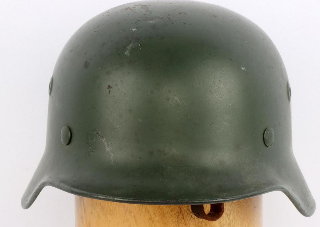 WWII GERMAN DOUBLE DECAL REPRO HELMET: Reproduction WWII German double decal helmet. Olive green painted with NSDAP shield and Police decals. 9 finger light brown leather liner marked "AK 57". Overall very good condition.