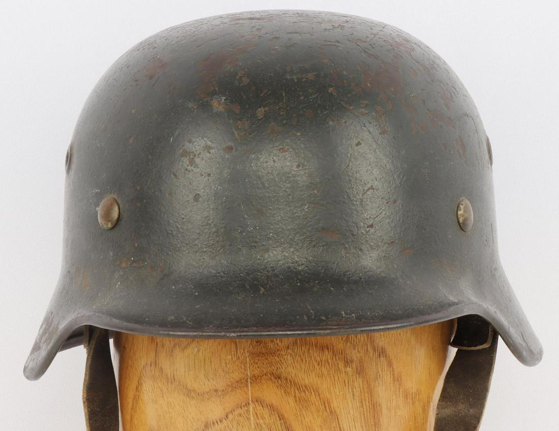WWII GERMAN NO DECAL HEER M40 HELMET W LINER: WWII German Heer M40 helmet with liner and no remaining decals. Forest green painted shell. Marked SE64 to left ear skirt for Sachsische Emailler und Sanzwerke A.G./Lauter. Numbered rear skirt 6386. 6