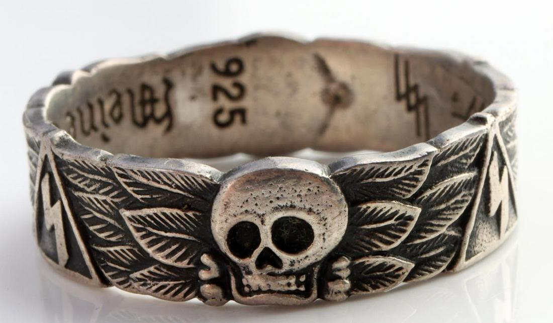 WWII GERMAN THIRD REICH SS HONOR RING: WWII German Waffen-SS H. Himmler silver honor ring. Band features a totenkopf with Viking runes around. 925 marked with SS motto. Size 11. Unauthenticated, sold as is.