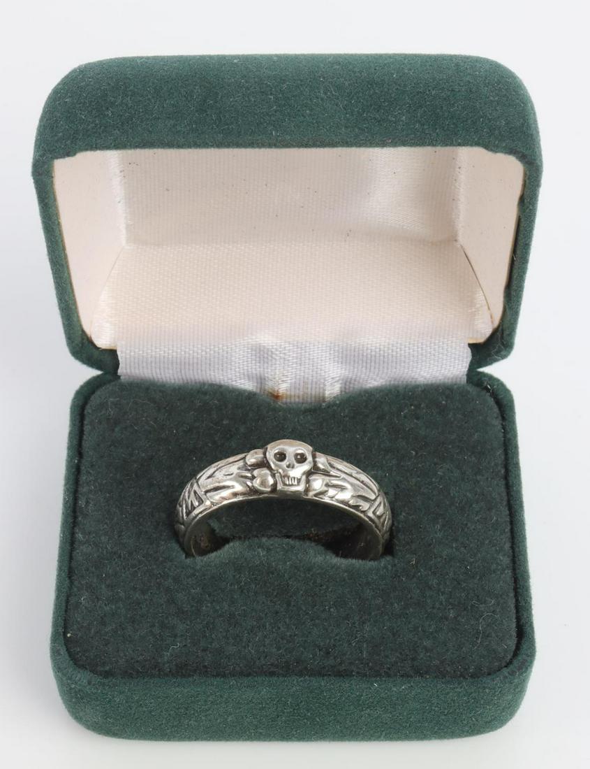 WWII GERMAN REICH SS TOTENKOPF HONOR RING: Ring size 11 1/2. Does not test for silver. Awarded name on interior of ring reads "H. Schulz" alongside facsimile Himmler signature and award date. Does not test for silver. Unauthenticated, sold as 