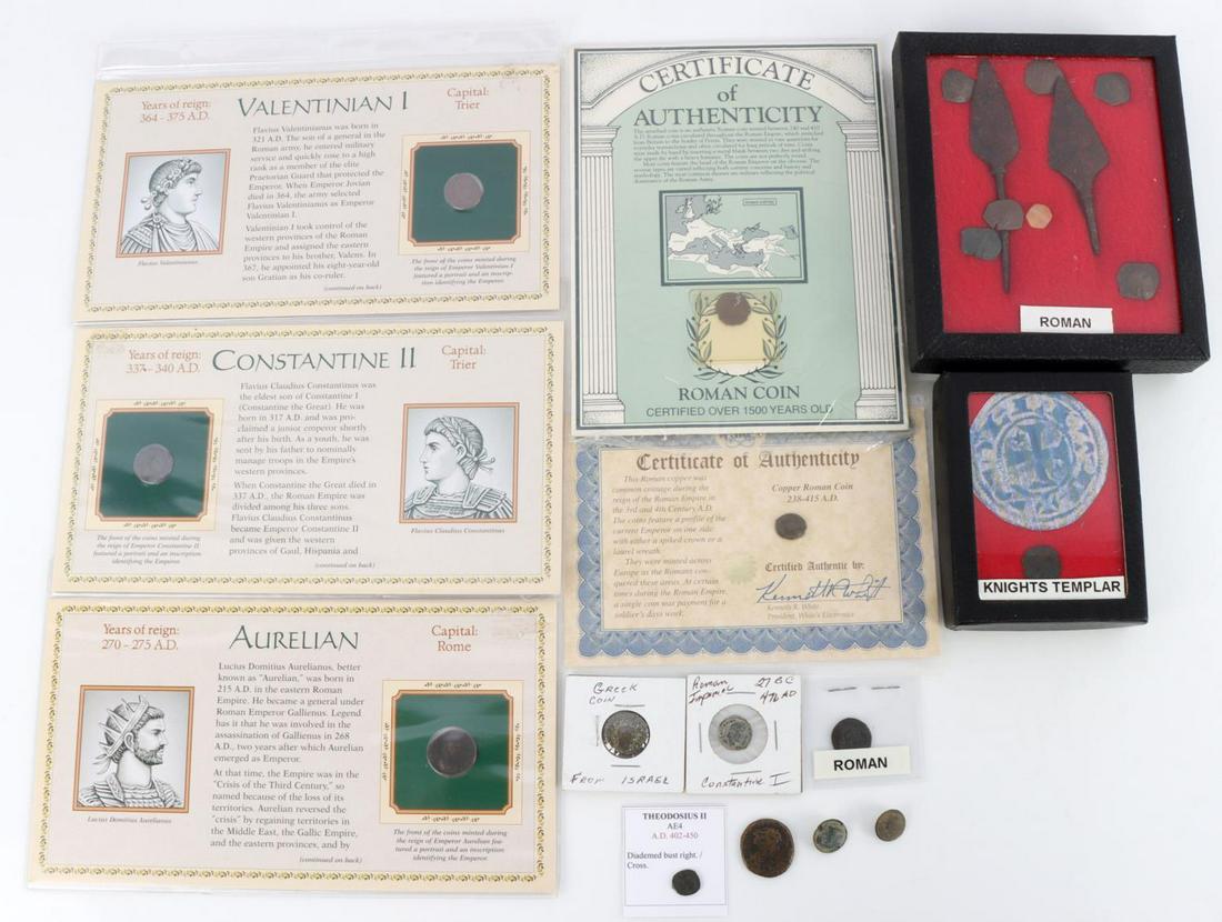ANCIENT ROMAN GREEK SPANISH COINS & PEON GROUPING: 9 Roman Empire coins from differing periods-some with COA's, 6 Eastern Roman cup coins, two Roman arrow heads, a Greek coin, two Spanish Peon buttons, and what appears to be a Knights Templar coin.