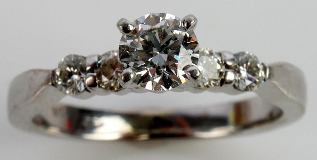 .462 CTW DIAMOND 18K WHITE GOLD ENGAGEMENT RING: Center diamond is prong set and measures .302 carat. Diamonds are VS2 and F-G in color. Ring is stamped "18K" inside shank. Size 4.5, total weight 3 grams. Ring is in very good condition without damag