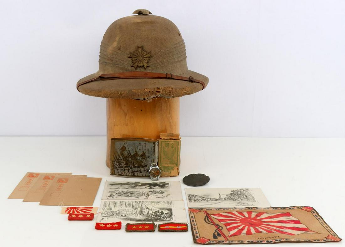 WWII JAPANESE HELMET COMPASS CIGARETTE CASE & MORE: Police Pith Helmet, damage to front, cigarettes, silk. postcards, working wrist compass, NCO collar insignia, cigarette case, Cherry blossom badge.