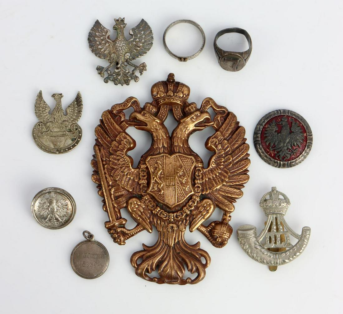WWII PICKELHAUBE PLATE POLAND RING BADGE LOT: Includes Imperial Prussian Officers Pickelhaube Plate, German Locket with Shrapnel encased in silver, Poland Badges Button and Polish ring size 12 in silver reads Legiony 16/VIII1914 Polski, lastly a 