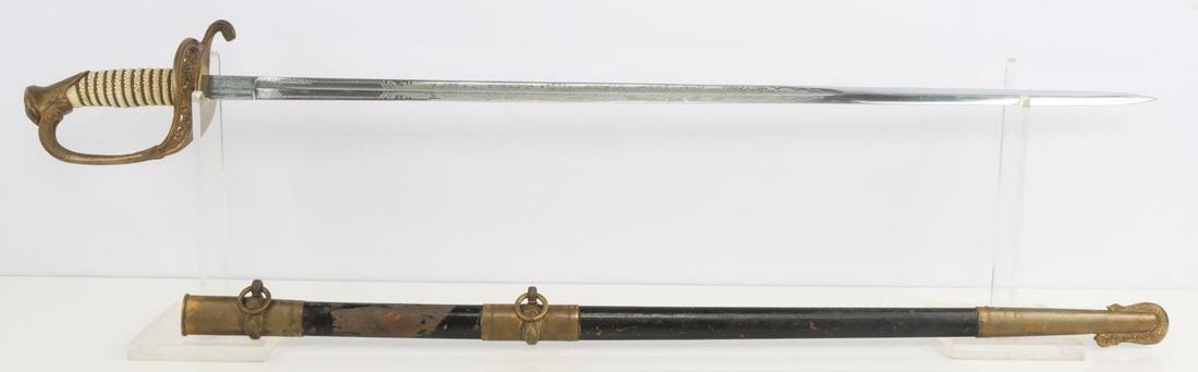 WWII US NAVY MODEL 1852 OFFICER SWORD HH MAKER: Engraved steel blade with shark skin grip and brass guard. Maker marked Hilborn and Hamburger Inc. Made in Solingen, Germany. Measures 34 3/4 inches.