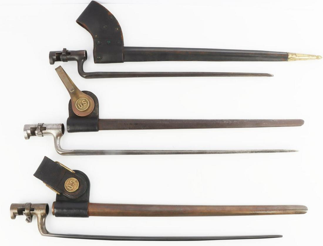 19TH CENTURY LOT OF US ARMY SOCKET BAYONETS: Model 1873 Springfield trapdoor bayonet with scabbard and frog- bayonet marked "US". Another bayonet with scabbard and frog-bayonet marked "LH" and "BF" with crown, scabbard marked "US" and "DCL". Las