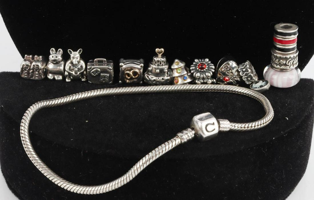 PANDORA STERLING SILVER JEWELRY AND CHARM LOT: Assorted Pandora sterling silver pieces including 2 bracelets (8 & 8.5 inches in length), a 19 inch necklace and several charms. Total weight of 115 grams. This lot has a reserve.