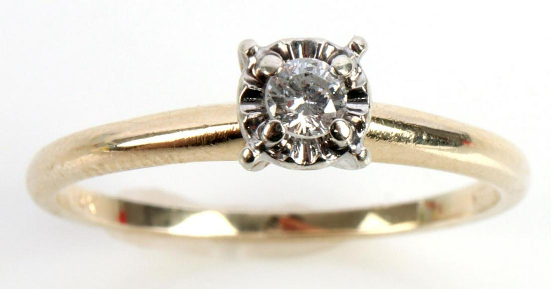 14KT GOLD DIAMOND SOLITAIRE ENGAGEMENT RING: Marked 14kt & Jaylen along inside band. Size 6 3/4. Total weight of 1.8 grams. Diamond solitaire measures approximately 2.8mm, round faceted, 4 prong illusion setting. This lot has a reserve.