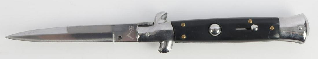 AKC ITALY SWITCHBLADE KNIFE NEW IN BOX: New in box, 8 3/4 inches open, 5 inches closed, black.