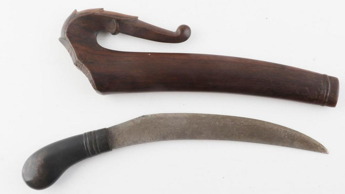 ANTIQUE INDONESIAN BADIK DAGGER SCORPION SCABBARD: Badik dagger with steel blade and horn grip. Wooden scabbard with scorpion tail pattern. Measures 9 3/4 inches overall. Very good condition.