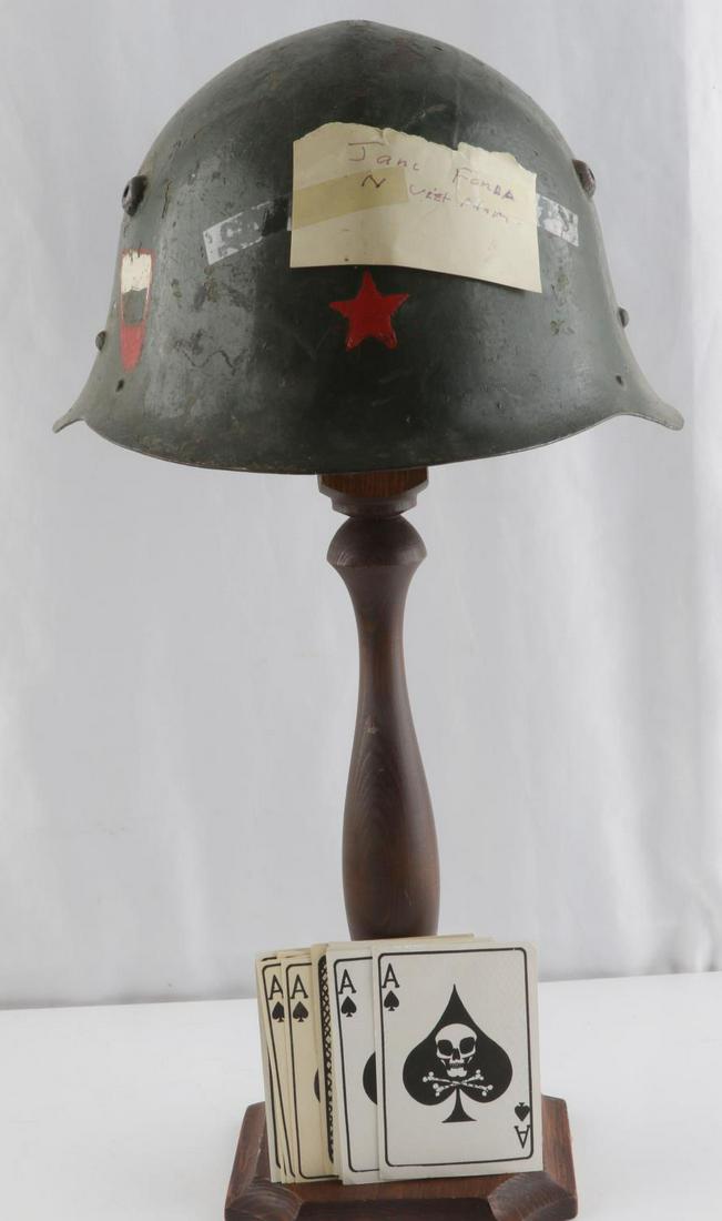 HANOI JANE HELMET ACE SPADES VIET CONG DEATH CARDS: Bulgarian helmet with not Jane Fonda N Vietnam, complete and similar to the one she wore on her "Tour." Also included are 15 reproduction Ace Of Spades "Surrender Viet Cong" propaganda cards.