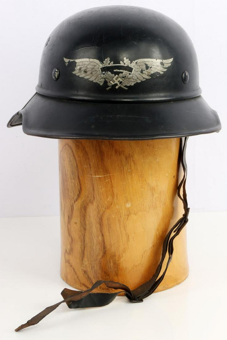 REPRO WWII GERMAN LUFTSCHUTZ HELMET: Likely reproduced WWII German Luftschutz helmet. Black painted steel. Luftschutz decal to front is off center to the left with Luftschutz marked out. Rear interior skirt stamped "R.L. 2 38/29" with so