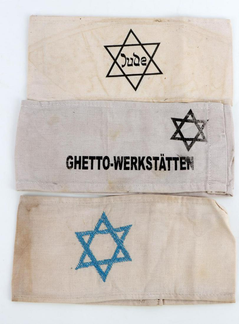 3 WWII GERMAN ARMBAND LOT GHETTO WORKSHOP JUDE: Lot of three cloth armbands includes embroidered Star of David, Ghetto Workshop, & Star of David /Jude. Some wear present throughout. Unauthenticated, sold as is. This lot has a reserve.
