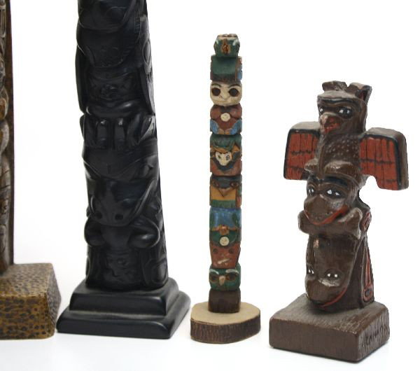 MIXED LOT OF NATIVE AMERICAN TOTEM POLES: Mixed lot of seven Native American totem poles including a Haida Indian totem pole. Most are hand carved and painted. Measuring between 14 and 5.5 inches.