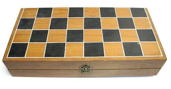 CHINESE BONE AND WOOD CHESS SET: Chinese chess set featuring carved bone and wood chess pieces. Board measures 18 by 18 by 3.5 inches. Overall in very good condition.