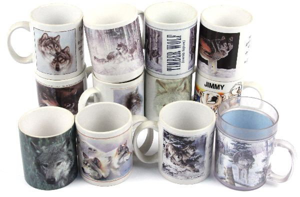 12 NATIVE AMERICAN WOLF THEMED COFFEE MUGS: Mix lot of 12 Native American coffee mugs. Wolf theme. In good condition.