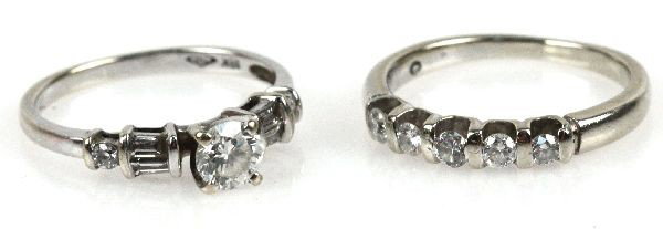 LADIES 14K WHITE GOLD AND DIAMOND WEDDING RING SET: Ladies, size 5, 14K white gold and diamond engagement and wedding ring set. The engagement ring features large round cut center diamond approx. 0.50 cts. with baguette and round cut accent diamonds. W