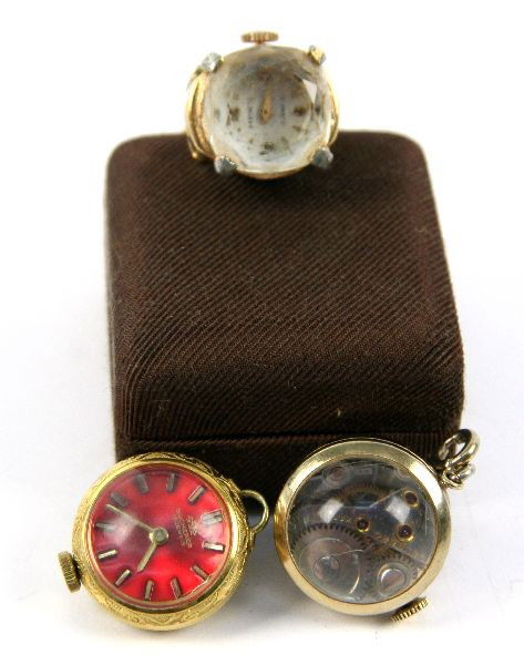 THREE 17 JEWEL BUBBLE WATCHES VARIOUS MAKERS: Three bubble watches including two pendants and one ring. Baroness 17 Jewel re-adjustable ring, Welsbro 17 jewel pendant, and Bucherer 17 jewel pendant. Baroness ring measures 1.5 by .5 inches, Welsbr