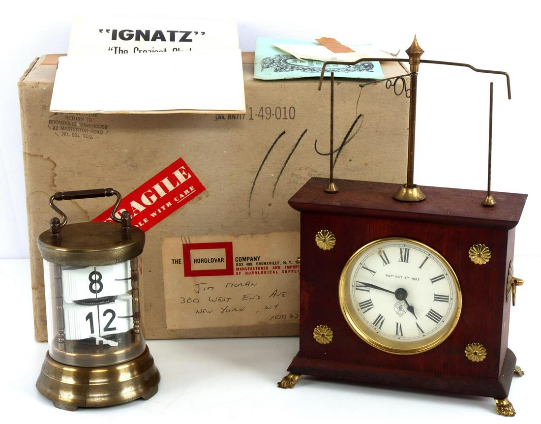 IGNATZ HOROLOVAR FLYING PENDULUM & FLIP CLOCKS: Horolovar Flying Pendulum clock, Ignatz. "The Craziest Clock in the World." In its original box with all original paperwork. Second is a Horolovar Flip Dial Carriage clock (does not appear to work).