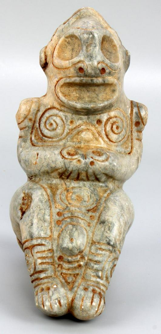 TAINO PRECOLUMBIAN SEATED GODDESS BIRTHING: Taino. PreColumbian. Seated goddess pushing belly to aid in delivery of emerging infant indicated by vaginal bulge between legs. A series of ghost faces appear as hidden icons. The swirls on the chest