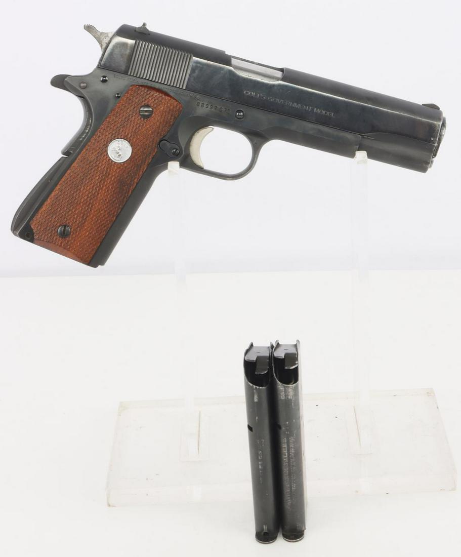 COLT 1911 GOVT MARK IV SERIES 70 SEMI AUTO PISTOL: Bore is bright and clear with distinct rifling. Appears minimally fired. Action is smooth and functions without issue. Good finish on steel and grips. Some surface loss at end of barrel bushing. Comes