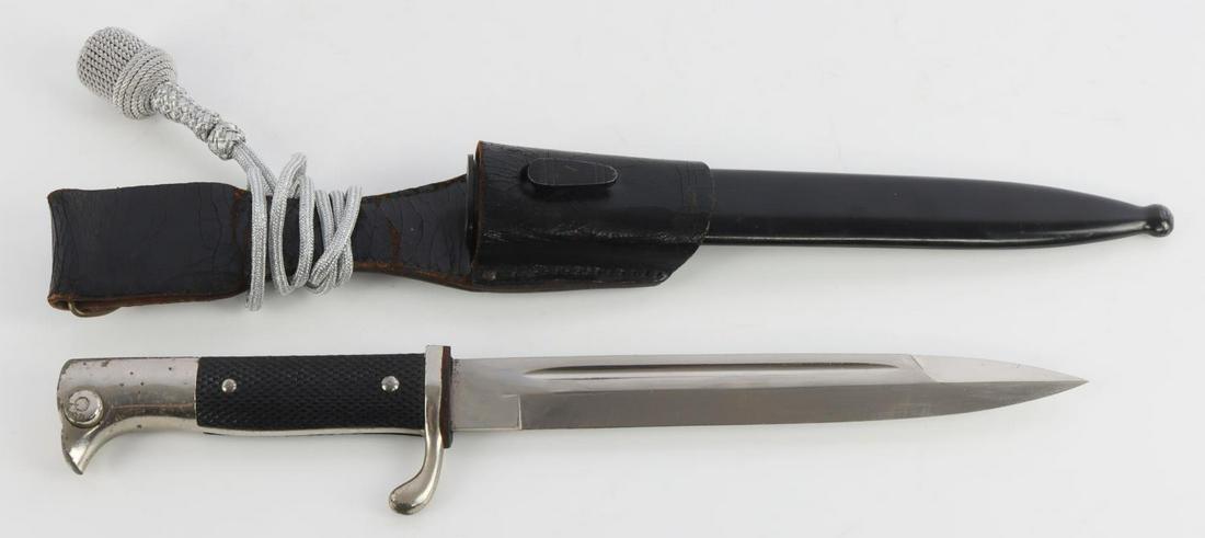 WWII GERMAN THIRD REICH MAUSER K98 DRESS BAYONET: Third Reich Mauser bayonet. Nickel plated Eickhorn blade, Bakelite grips, housed in magnetic scabbard and Eickhorn frog. Measures 13 3/4 inches. Very good condition. Comes with portepee.