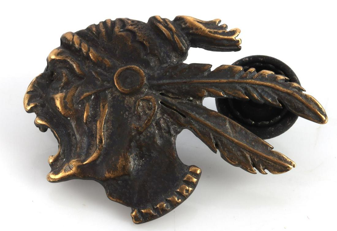 WWI US 93RD AERO SQUADRON AEF LAPEL BADGE: Measures 1 1/4 inches wide by 7/8 inches tall.The front shows the profile of an American Indian warrior wearing a two feathered bonnet. Thereverse side has two screw mount posts. This was to have been