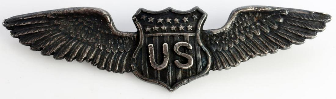 US WWI AERO DUNHAM PILOT AVIATOR WING: Measure 2 3/4 X 3/4 inches. Front shows a shield with letters US in center flanked by a wing on each side. Reverse marked sterling. Very good condition. Unauthenticated, sold as is.