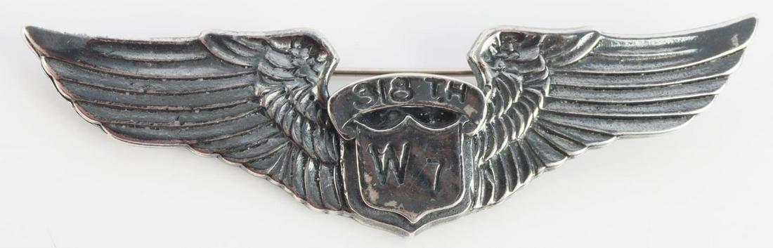 WWII USAAF WOMENS AIR SERVICE PILOT BADGE: USAAF WWII Womens Air Service Pilot WASP 318 th W 7 Class Wing. Measures 3 1/8” wide by 7/8” tall. The front has a shield in the center that reads ‘318 th W 7’. It is flanked by a wing on each